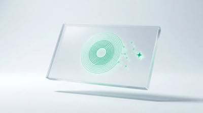 Single frosted glass slab with an etched emerald dial and small node graph, an abstract emblem of a built marketing automation system.